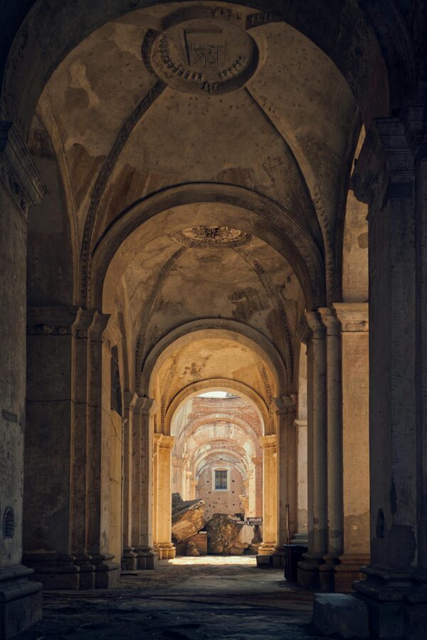 Explore the ancient archways of a historic site in Antigua, Guatemala, capturing timeless architecture.