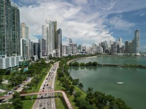 Stunning aerial shot of Panama City's skyline with coastal views and busy streets.
