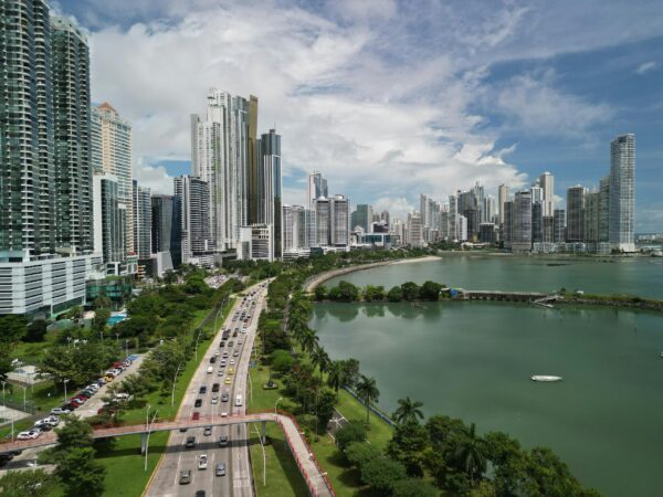 Stunning aerial shot of Panama City's skyline with coastal views and busy streets.