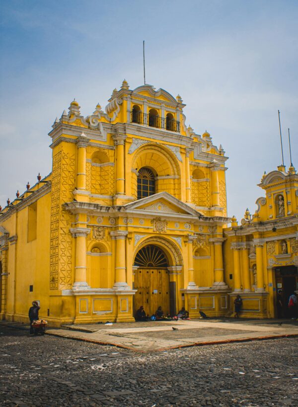 Vibrant facade of La Merced Church, showcasing colonial architecture in Antigua Guatemala.